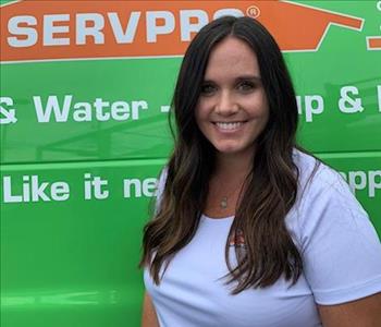 SERVPRO office manager is shown, female, long brown hair